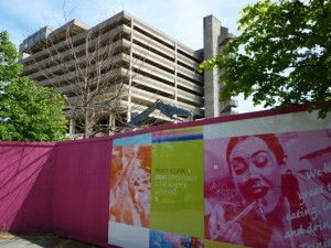 Hoardings promoting the new surround the old (18 Jun 2010). Photograph by Graham Soult